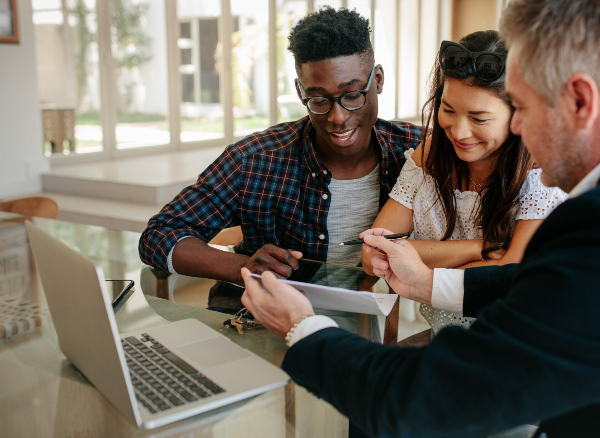 couple at laptop with estate agent